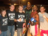 Fight Shop Mixed Martial Arts fight club in the winners circle, Big T Trainer/Manager