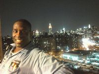 Me about 8 stories up @ Work (East River & NYC Skyline behind me)