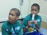 Both of my sons before surgery. Yes they are twins. Double trouble!  Lol