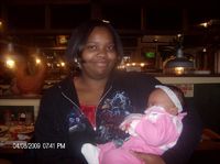 Me holding my friend's baby at Chili's.